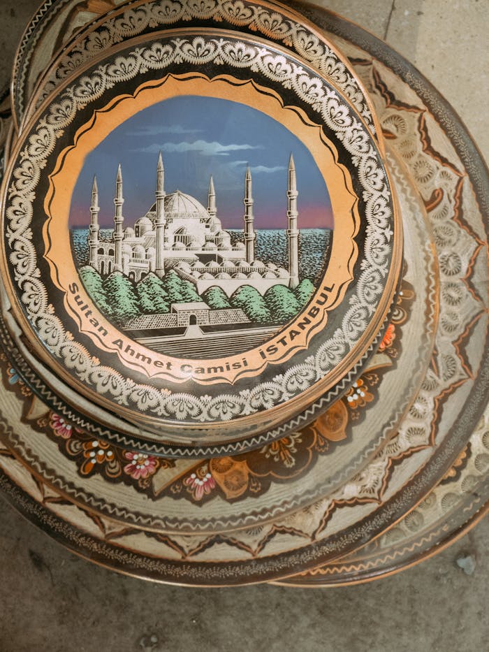 gallery-01 Stack of decorative ceramic plates featuring Istanbul's Blue Mosque design in vibrant colors.